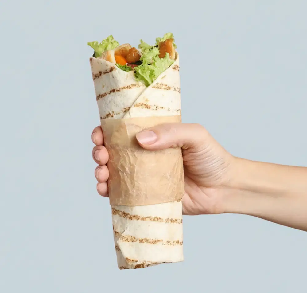A person holding a wrap